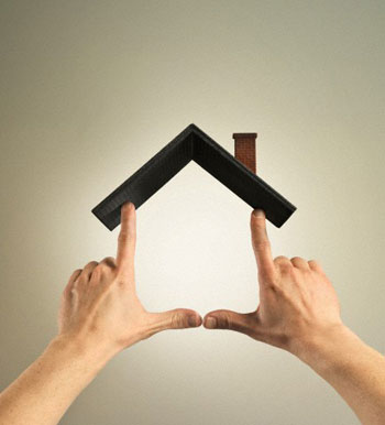 Hands making house shape