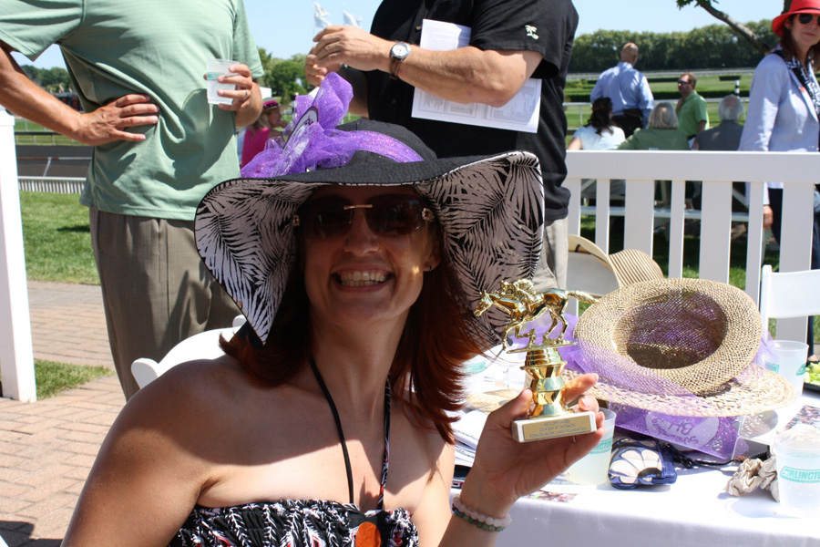 Rebecca-Litgen-with-Hats-Off-trophy