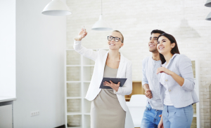 Real estate agent with young couple
