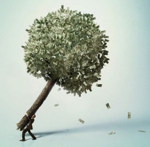 Businessman carrying money tree