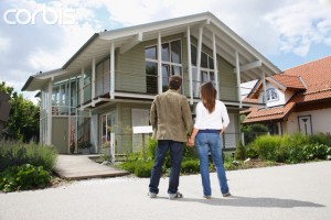 Young Couple Looking at House