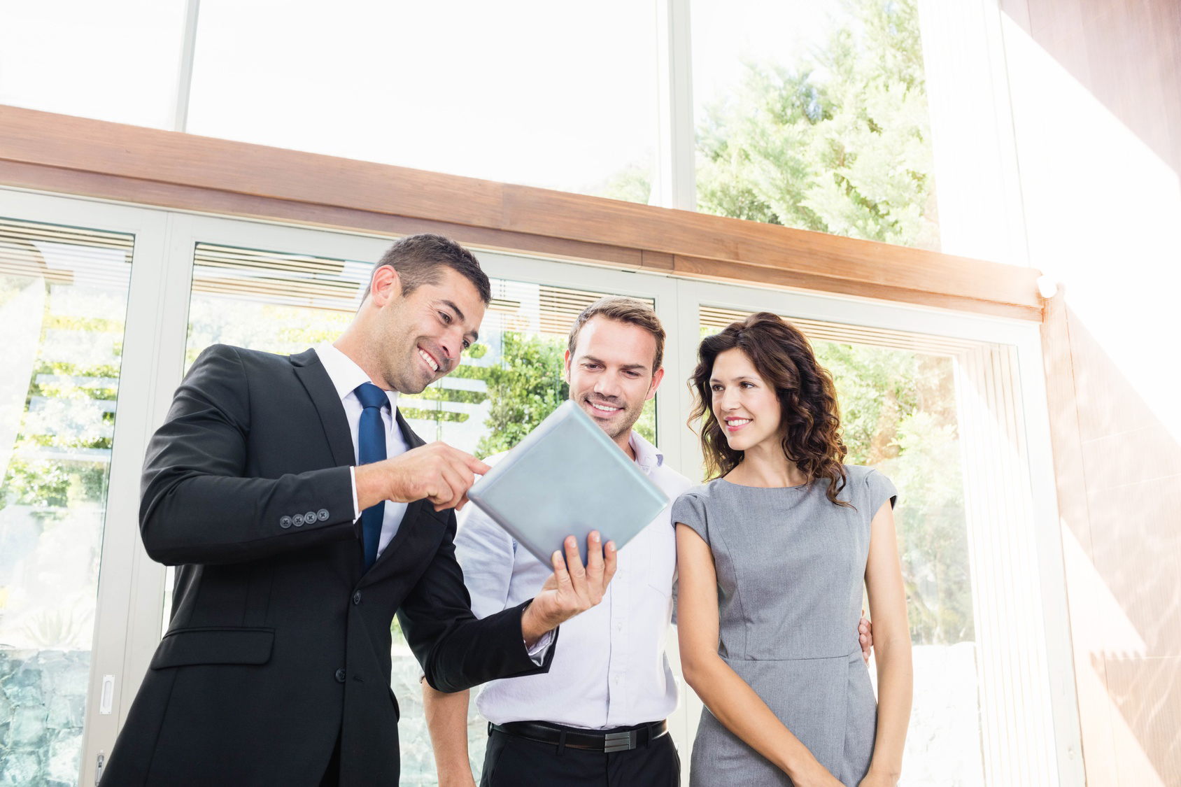 Realtor at a showing with a couple.