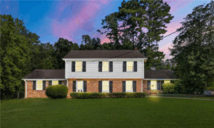 The exterior of the 2-story brick and white-siding "Wheeler House" featured in Stranger Things.